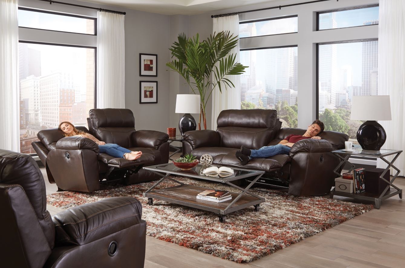 family reclining on their leather reclining sectional