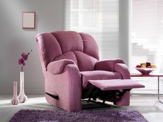 view of a pink manual recliner in a modern grey room with pink accents
