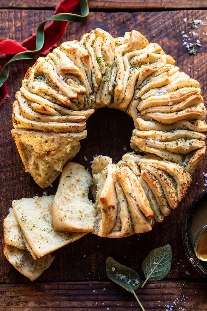 Pull apart bread wreath on a wood table
