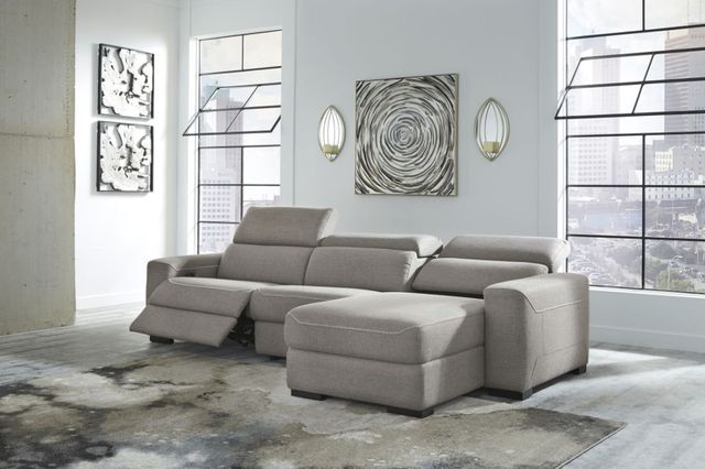 front view of a contemporary grey reclining sectional sofa with chaise in a modern home