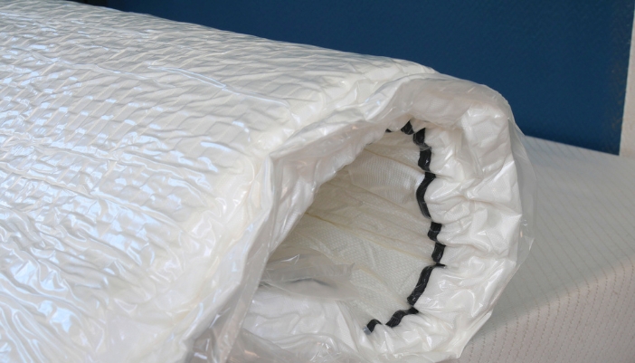 Mattress-in-a-box unrolling, looks thin