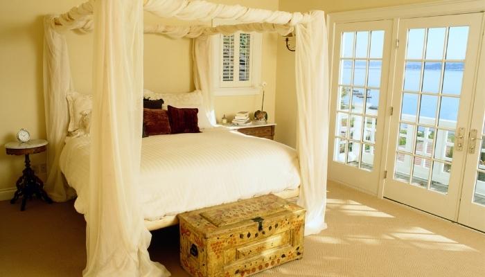 canopy-style bed in a seaside cottage