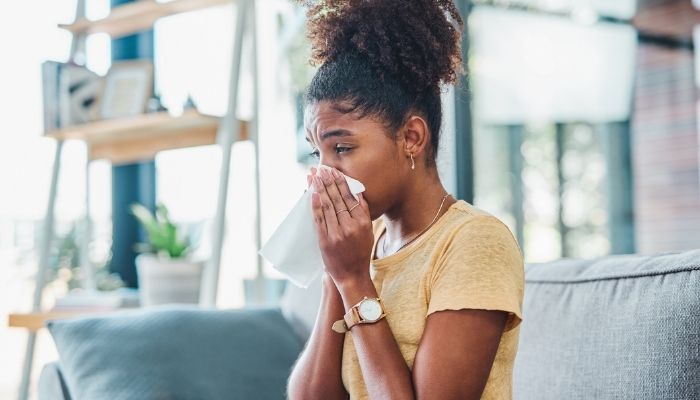 girl blowing her nose