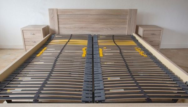 Wooden slats of a wood bed frame without a box spring