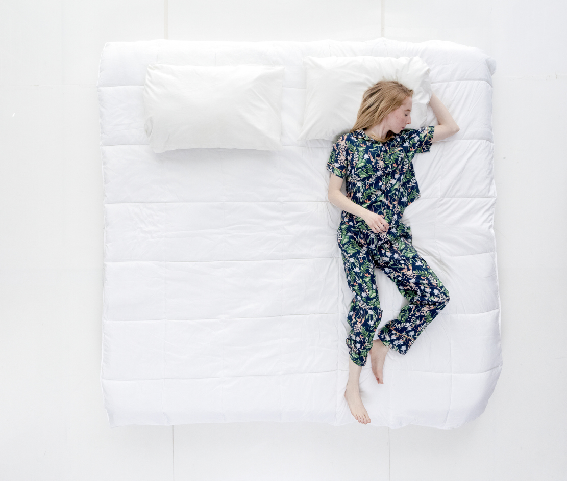 woman sleeping on her back for the best sleep position