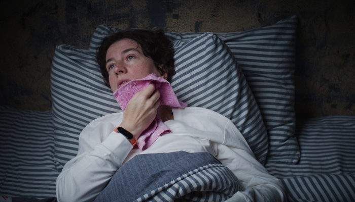Woman sleeping too hot