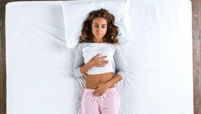 Top view of woman laying on bed