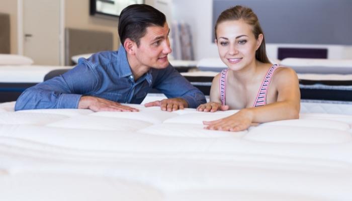  Woman testing out new mattress