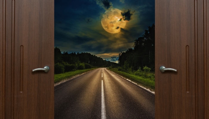 Door opening to dreamy landscape; lucid dreaming concept