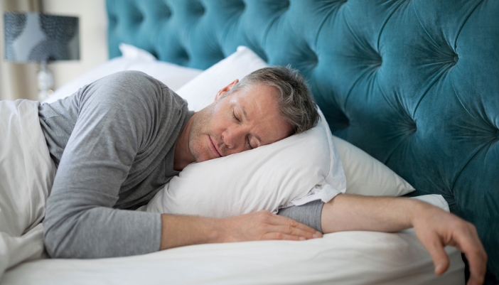 Mature man sleeping on his side