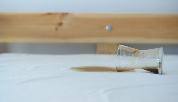 Closeup of a coffee spill on a mattress