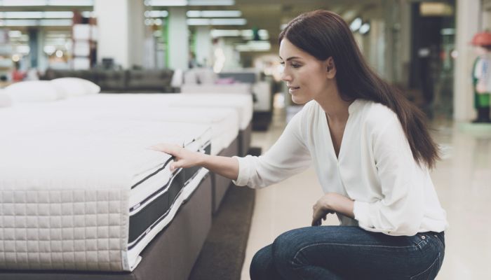 a woman in a mattress store