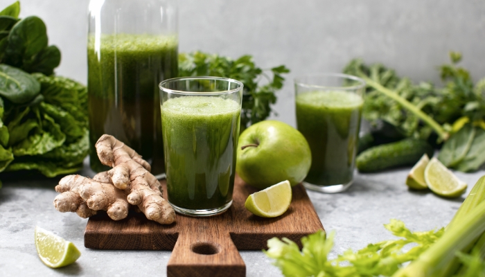 An assortment of leafy greens and juice