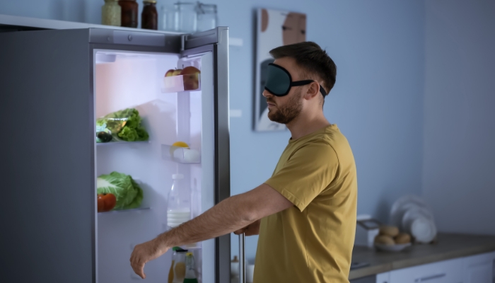 Man sleepwalking and opening the fridge