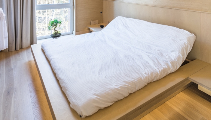 An adjustable bed with the head raised up