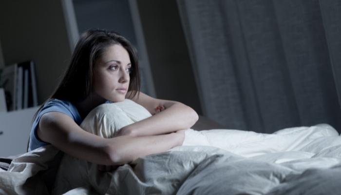 Woman in bed, unable to sleep