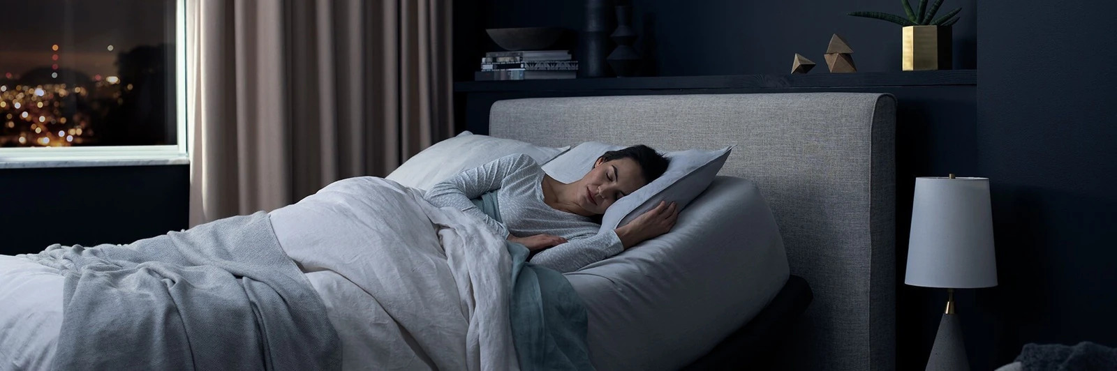 woman sleeping in a raised position on adjustable bed