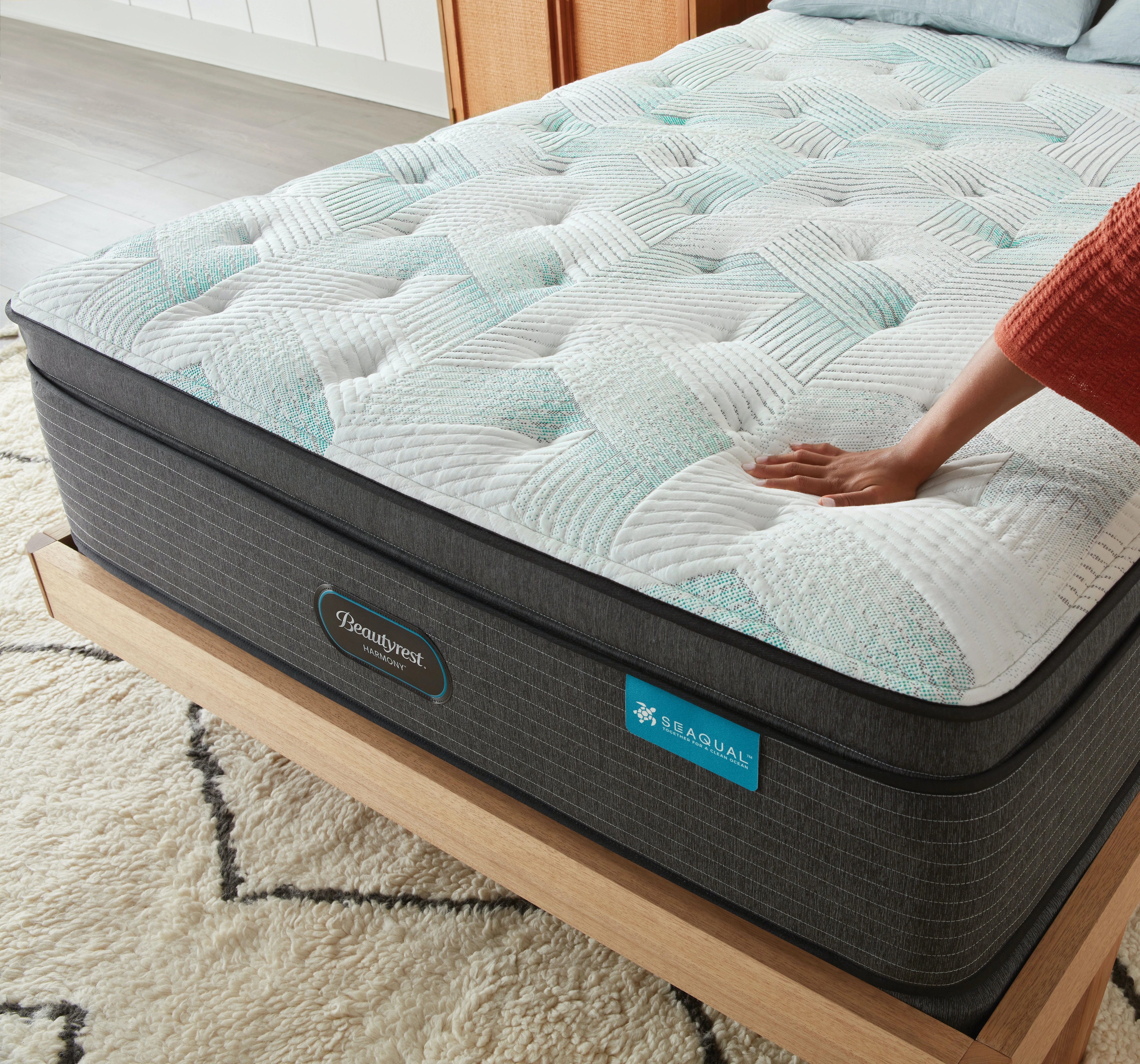 hand testing firmness of mattress