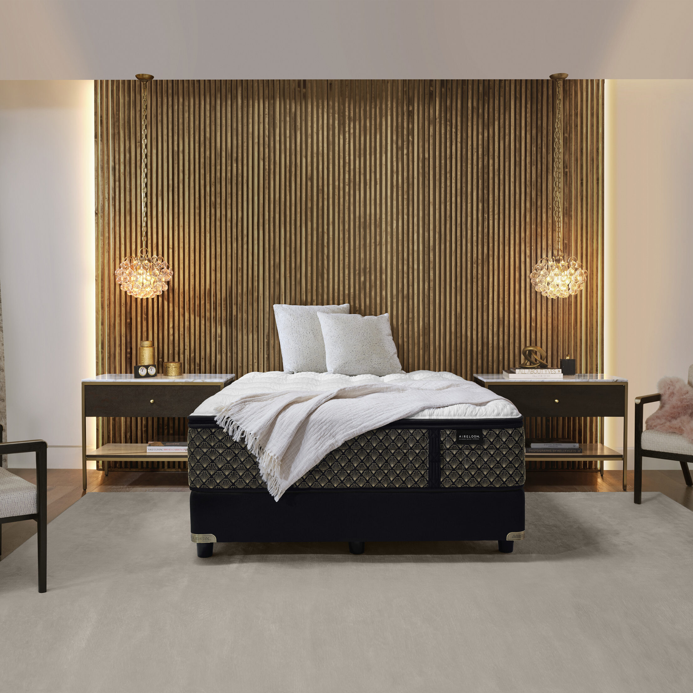 An Aireloom mattress against a bamboo wall in a luxury bedroom