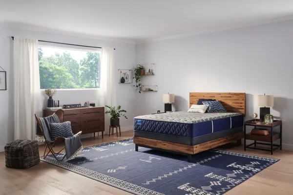 The Sealy Carrington Chase Spring Midnight Cove collection lifestyle image in a bedroom 