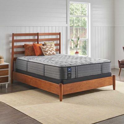The Sealy Posturepedic Satisfied II mattress in a bedroom 