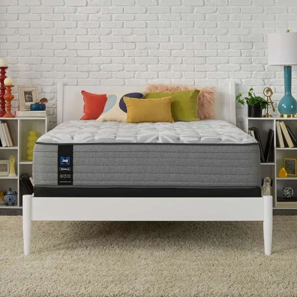 The Sealy Posturepedic Sliver Pine mattress with bedding and décor 
