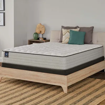 The Sealy Posturepedic Spring Bloom mattress in a bedroom 