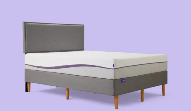 Purple queen mattress in a purple room with a gray bed frame
