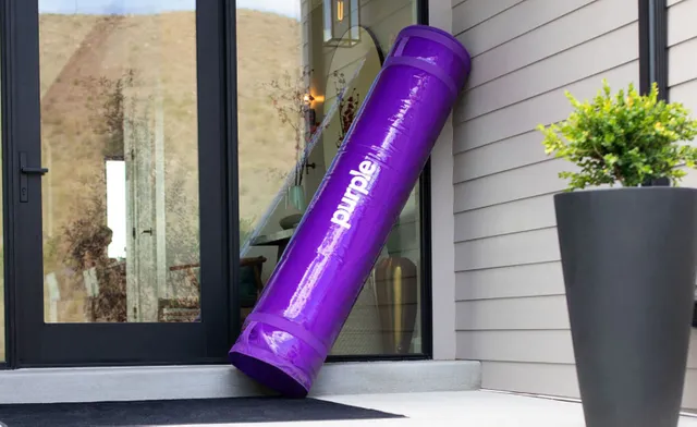 Purple mattress in a box delivered to a home