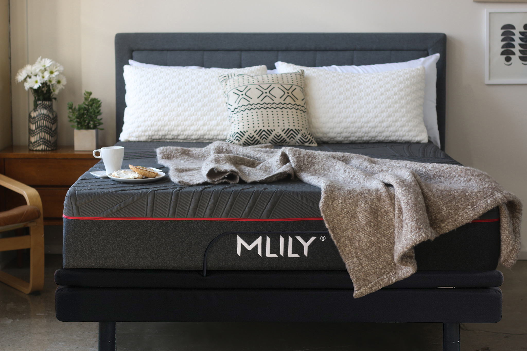 An MLILY memory foam mattress shown with a throw and a platter of breakfast 