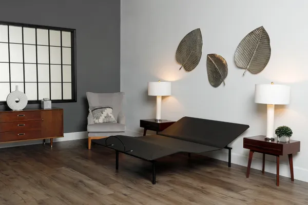 side view of an adjustable bed base in a mid-century modern bedroom