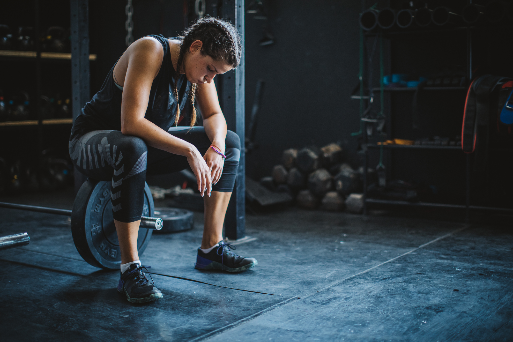 woman exhausted after lifting weights