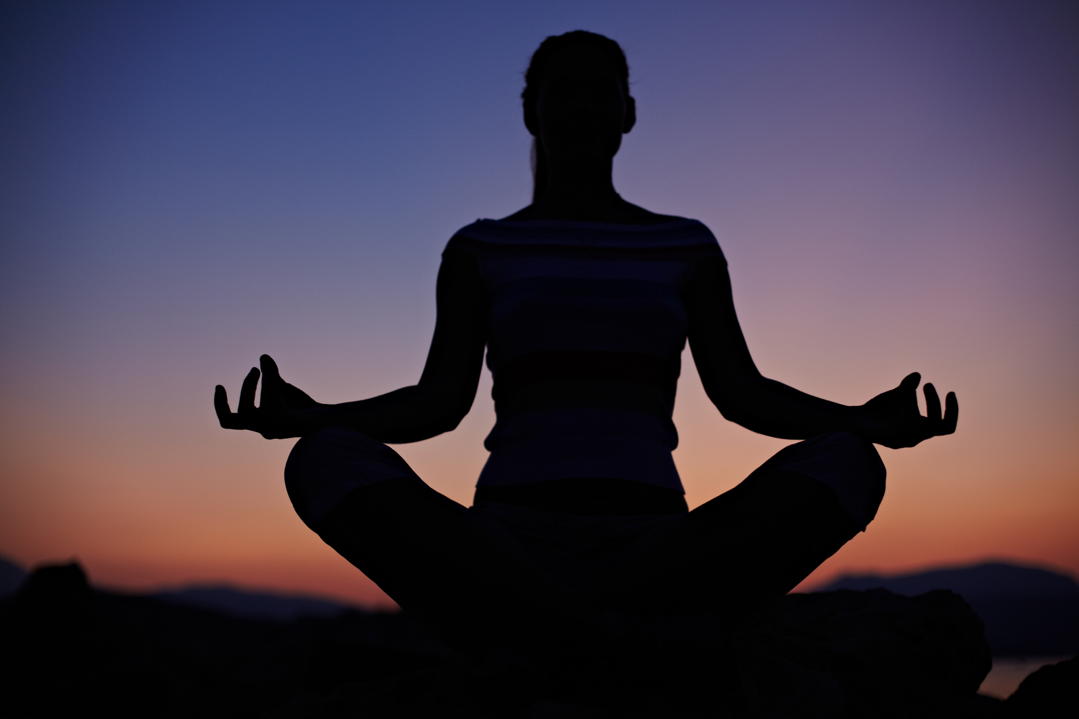doing yoga at sunset