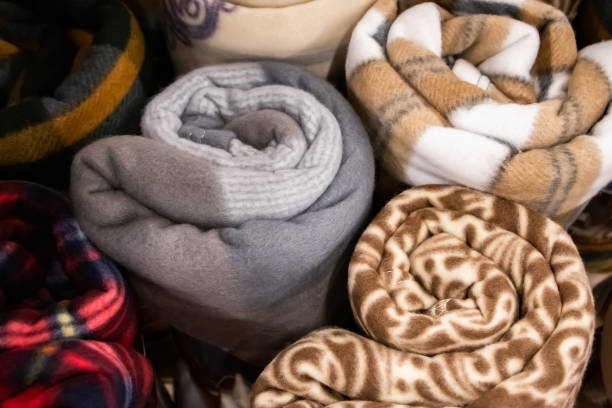 bundles of decorative blankets rolled up