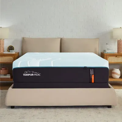 The Tempur-Pedic LuxeAdapt mattress with bedding and décor 