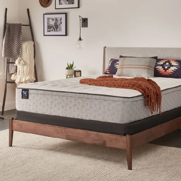 The Sealy Essentials Spring Hayward collection mattress with bedding and décor 