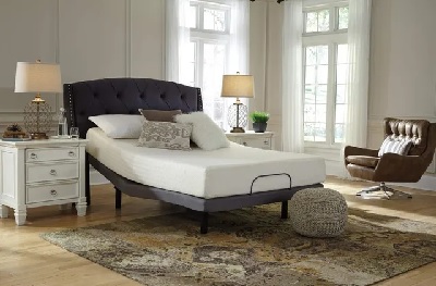 The Sierra Sleep by Ashley Chime collection memory foam mattress on an adjustable bed frame with décor 