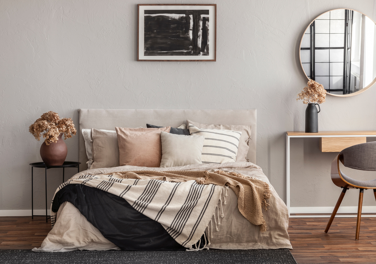 bohemian bed is covered with assorted throw pillows