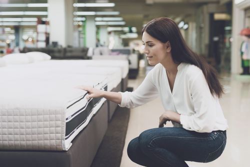 Woman Shopping for a Mattress
