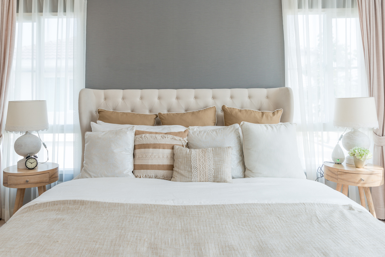 big comfortable double bed in elegant classic bedroom at home
