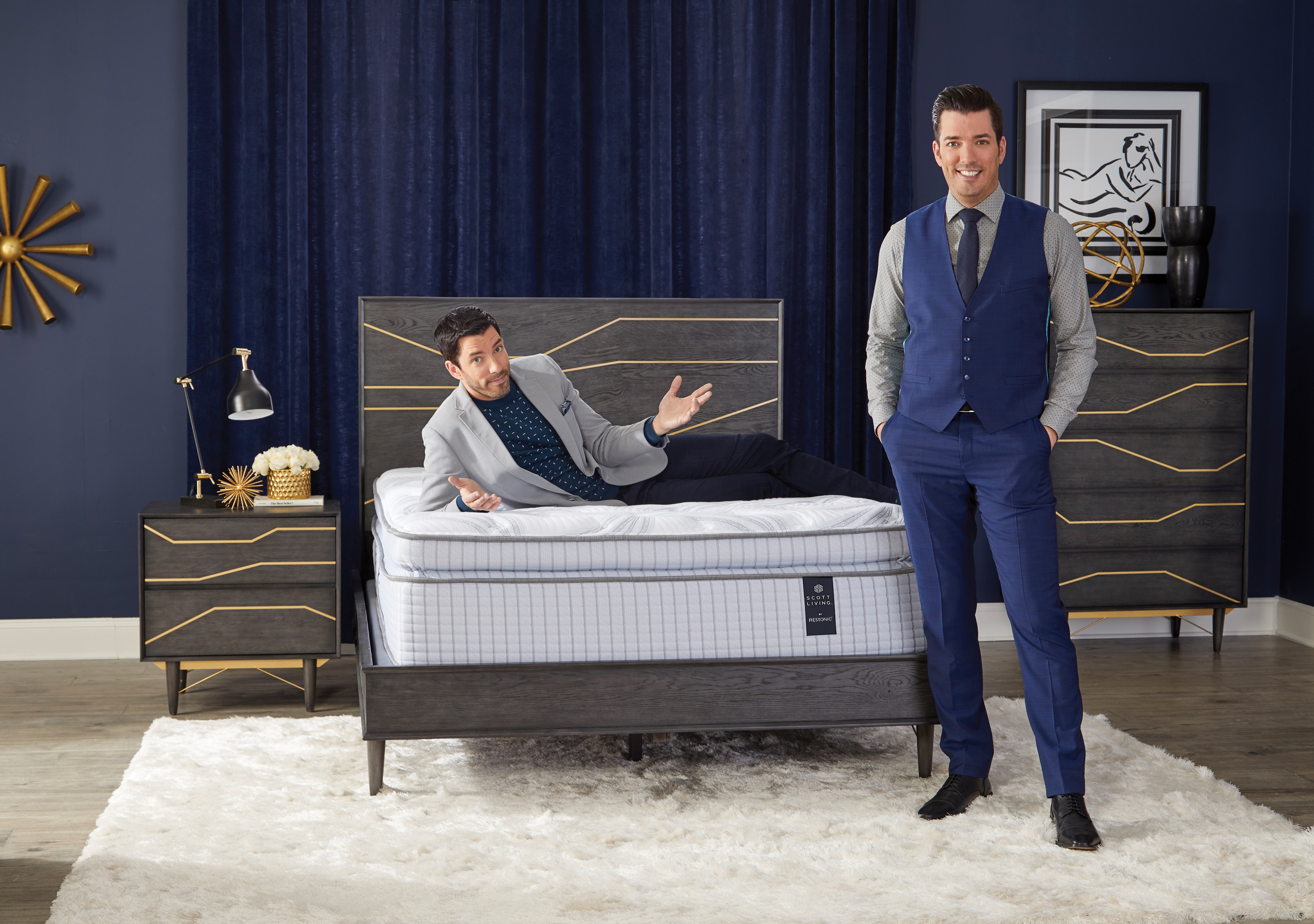 Drew and Jonathan Scott pose next to Scott Living mattress