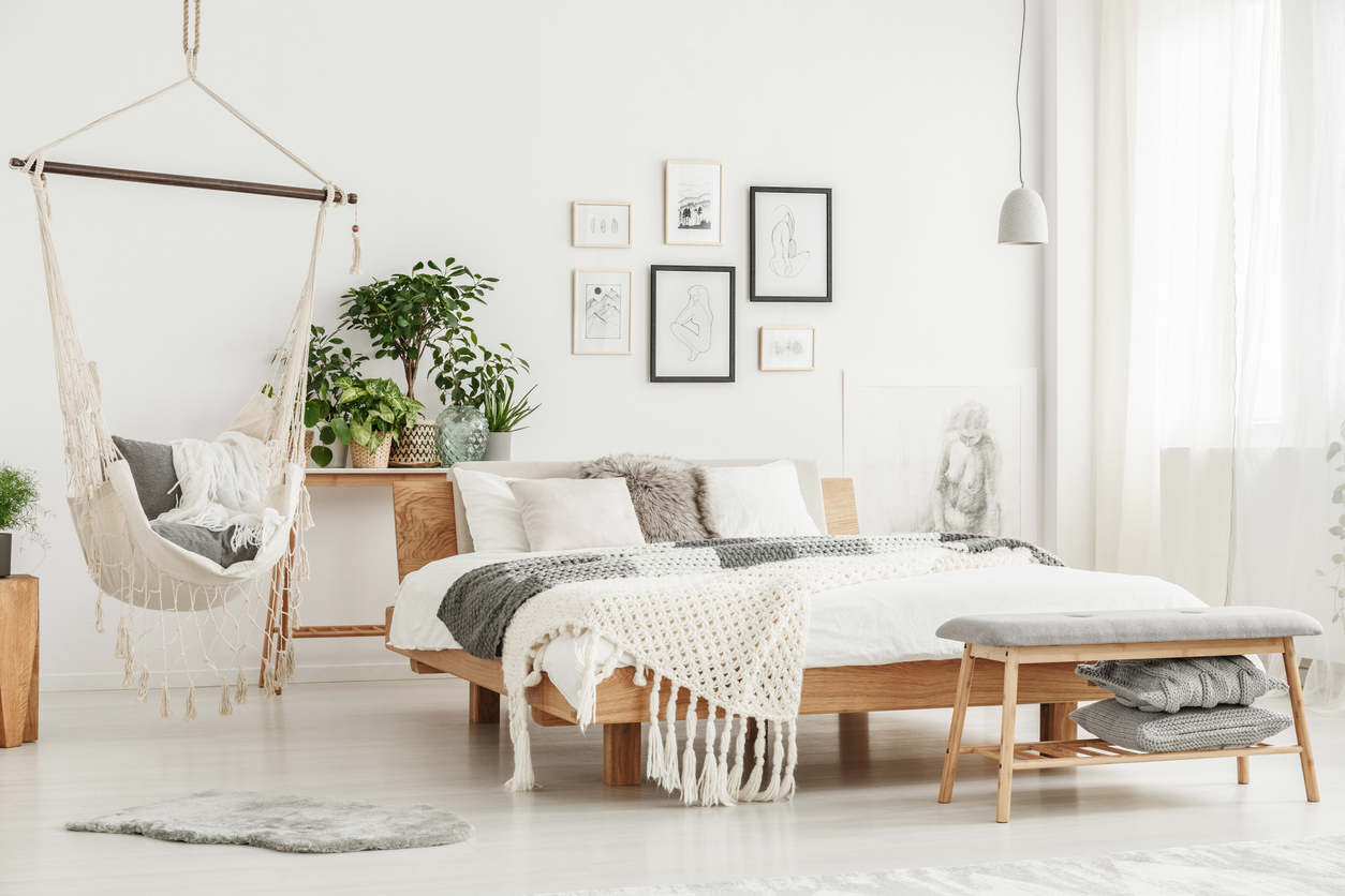 white minimalist bedroom with light-toned wood furniture