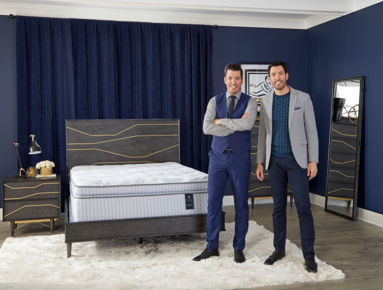 Drew and Jonathan Scott pose next to a Scott Living mattress