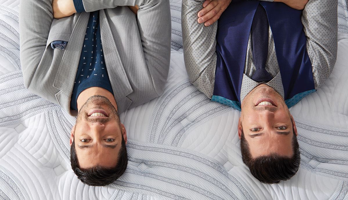 upside-down closeup of Drew and Jonathan on a Scott Living mattress 
