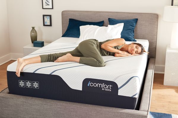 A woman sleeping on a Serta mattress