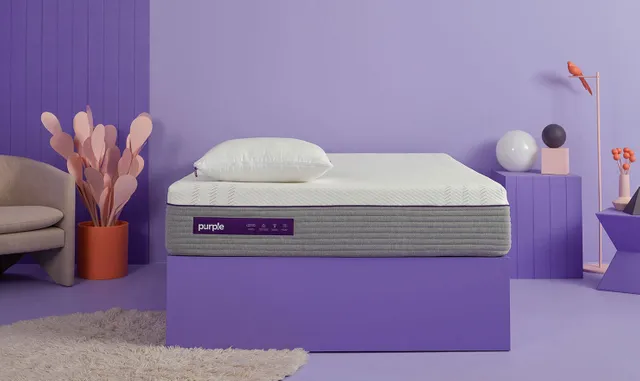 The Purple hybrid smooth top mattress with purple and pink décor 