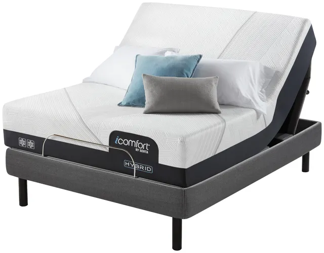 Front view of the Serta iComfort Hybrid CF2000 queen size hybrid mattress with throw pillows 