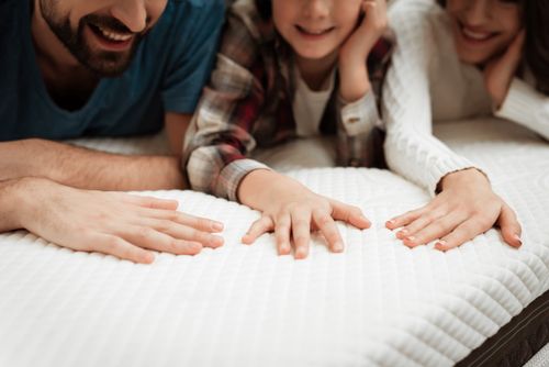 Family Feeling a New Mattress