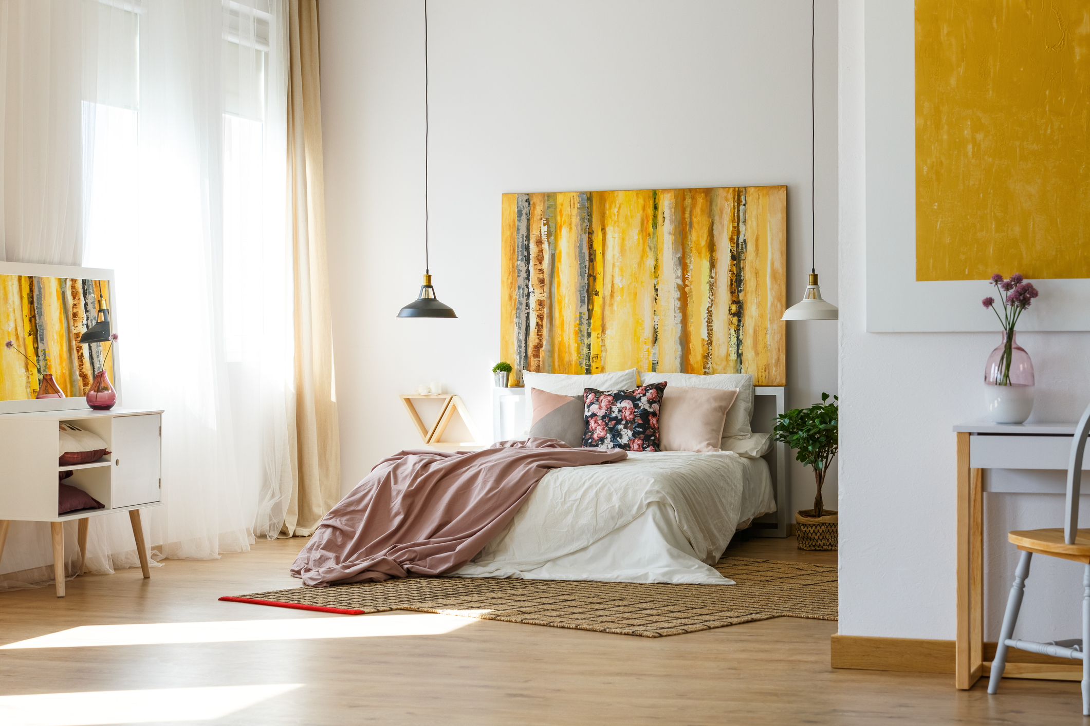 spacious bedroom with yellow accents 