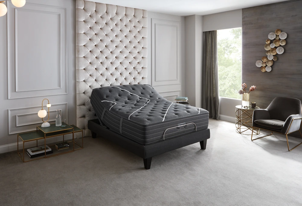 The Beautyrest Black Smart Motion adjustable bed frame shown with a mattress 